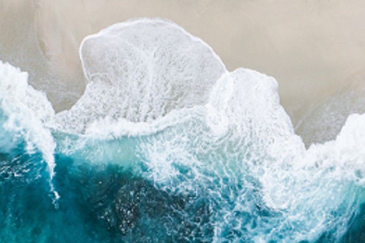 Seawater crashing on beach